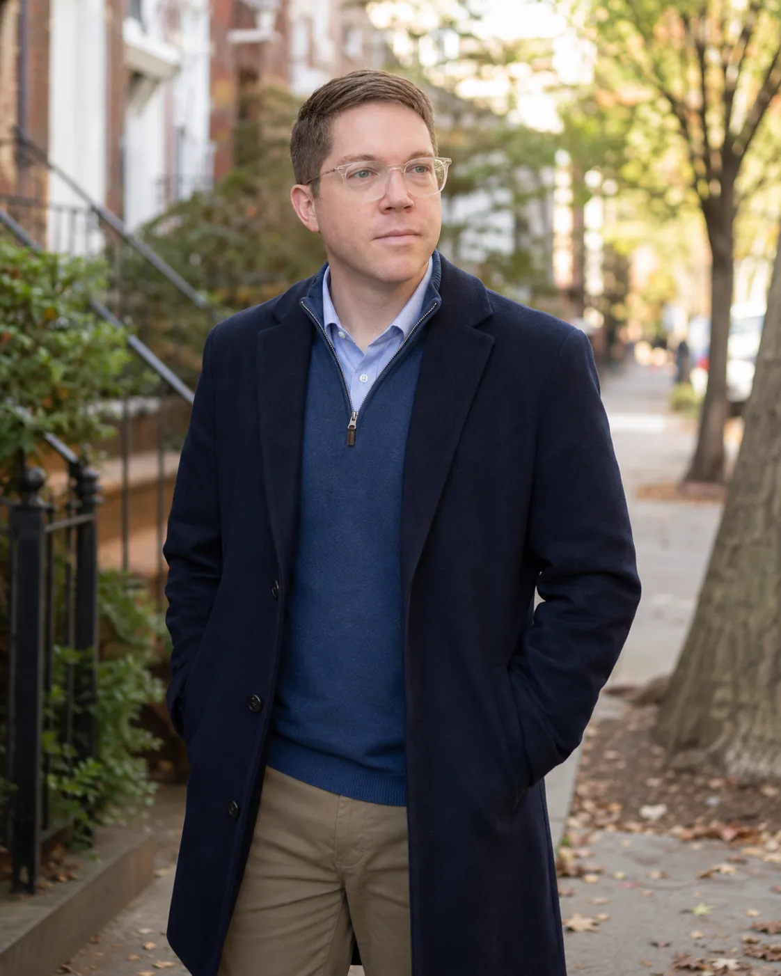 Yair Walton, standing on a tree lined street in Cincinnati